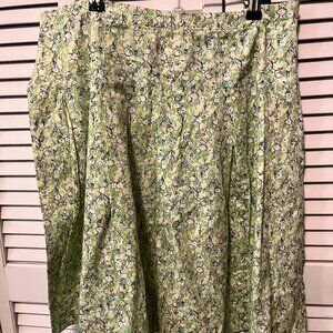 Pleated skirt, knee length, stitched down pleats, yellow & green print. Size 10.